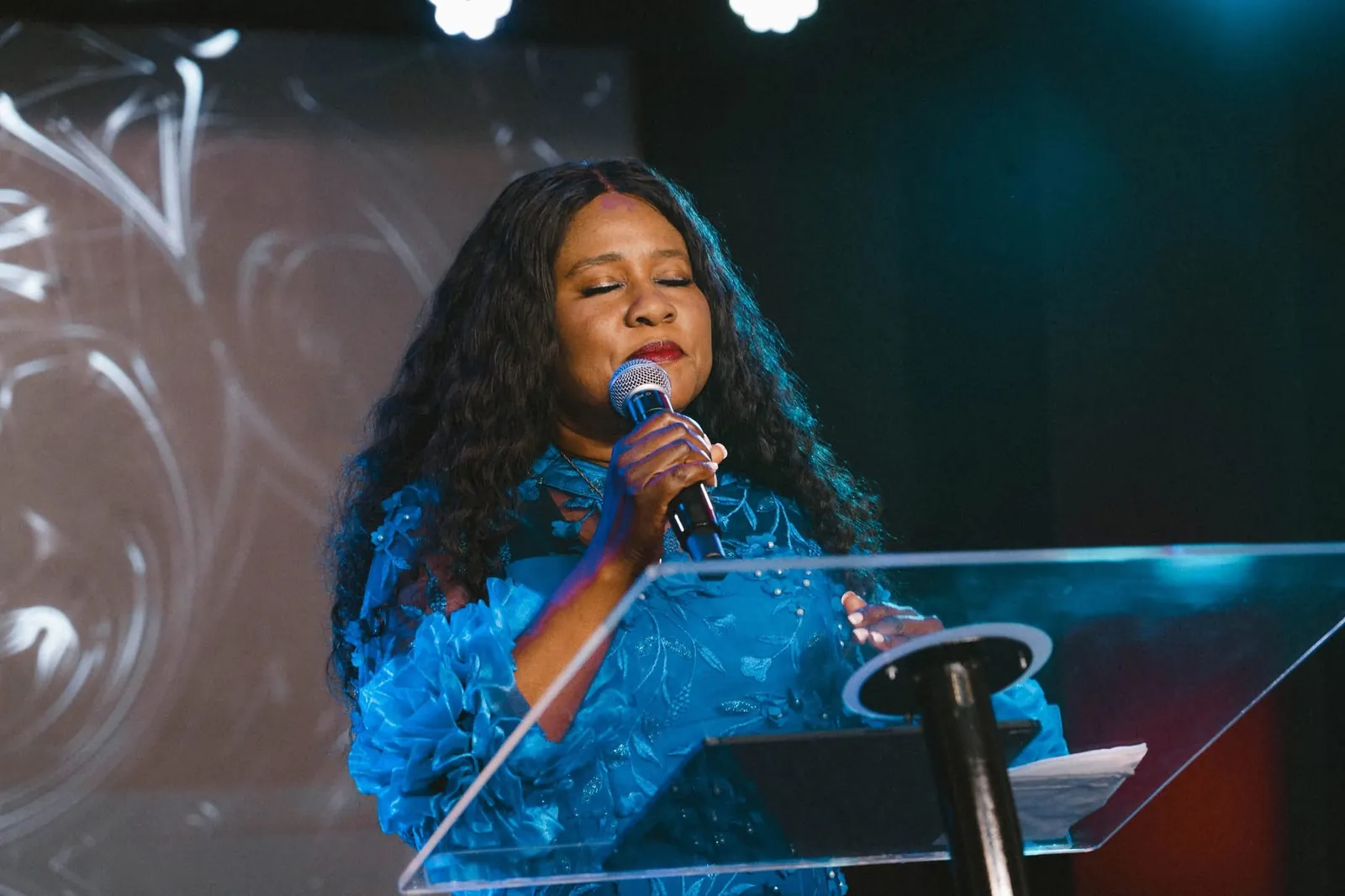 A minister singing from the pulpit